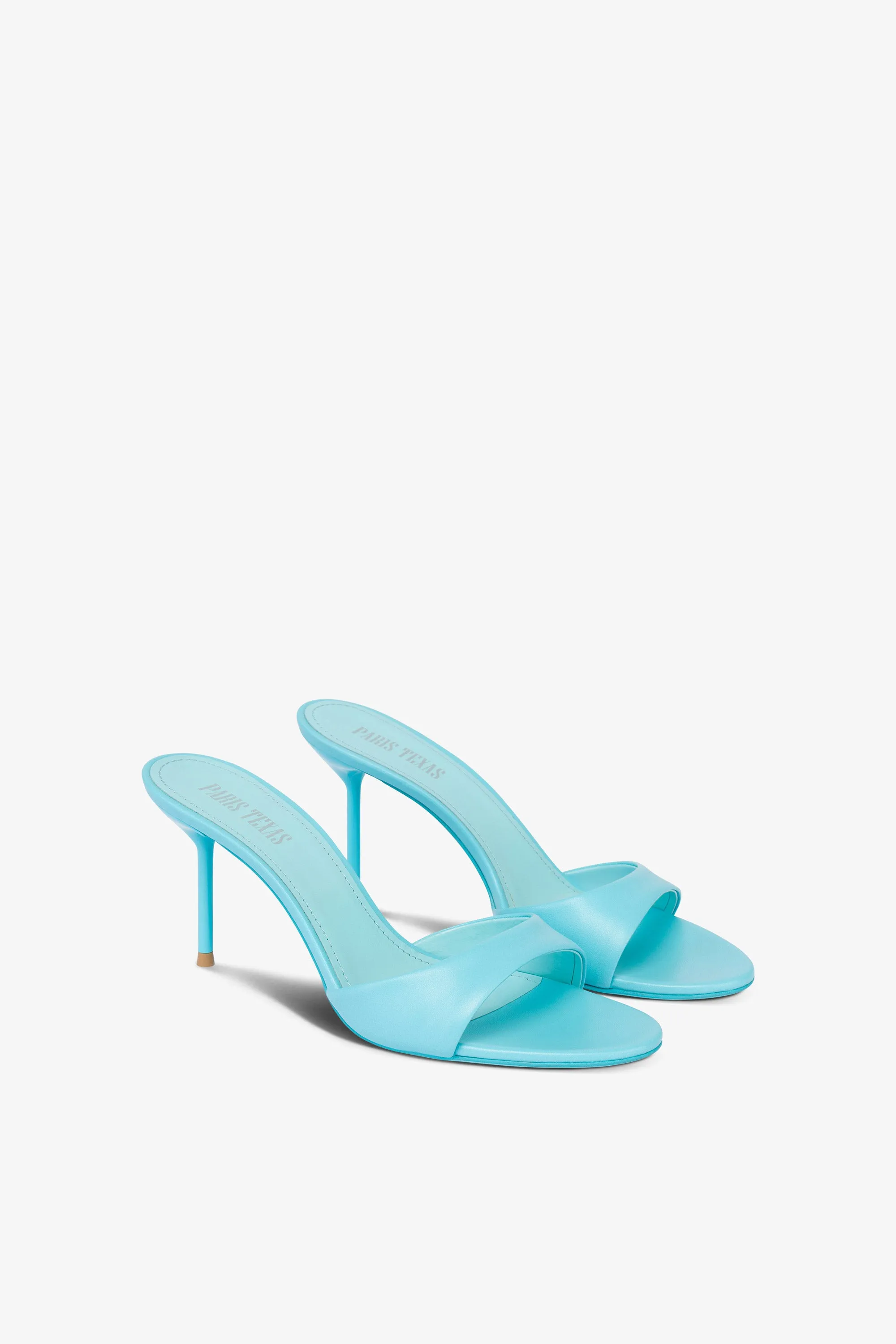 Mules in turquoise leather